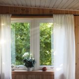 white rod pocket curtain on window frame