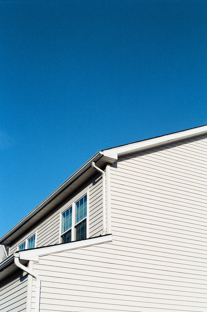 white wooden house under blue sky during daytime